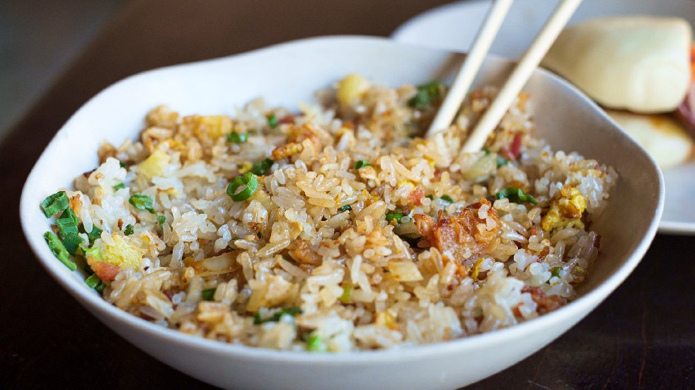 bowl of fried rice with egg and peas